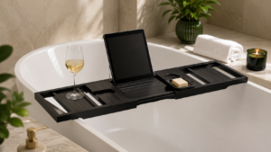 Adjustable black bathtub tray displayed across a modern bathtub